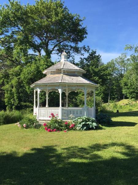 gazebo on lawn with flowers